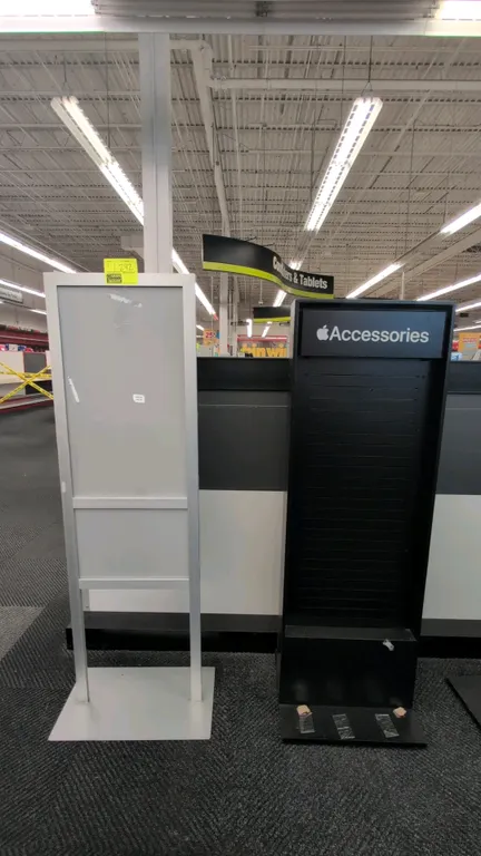 Assorted retail displays. Includes (1) silver-tone metal freestanding sign holder and (1) black Apple Accessories slatwall merchandise display rack. B