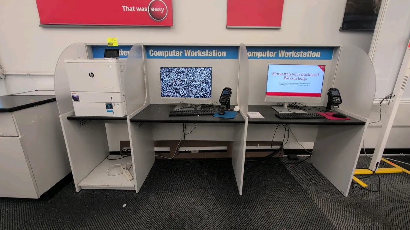 Laminate 3-compartment workstation desk unit. Features black laminate work surfaces, white laminate frame, frosted acrylic privacy dividers, and dedic