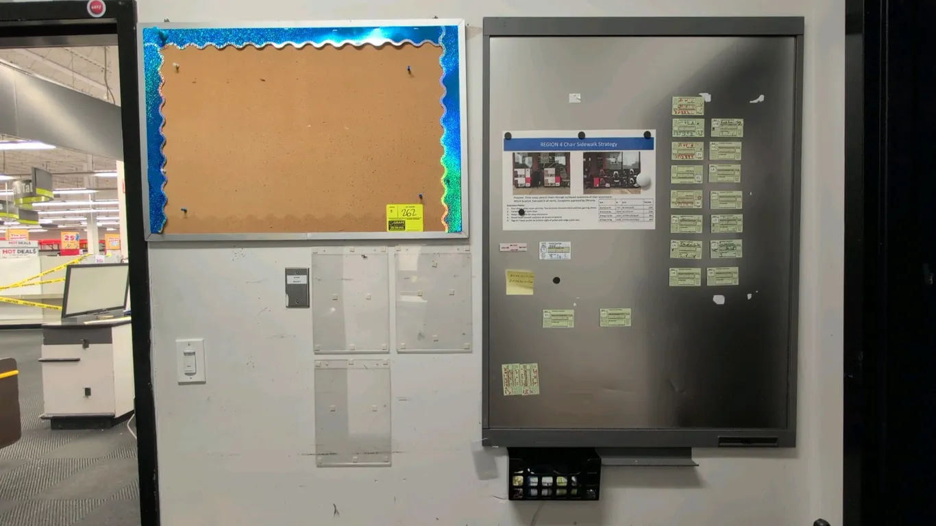 Metal-framed bulletin board lot. Includes (1) 2'x3' corkboard with aluminum/metal frame and (1) 3'x4' metal magnetic bulletin board with integrated ma