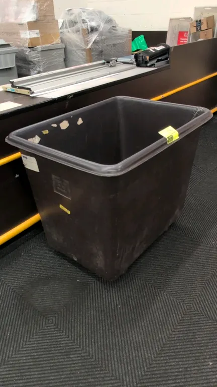 Poly portable container. Features molded polyethylene construction with a rolled top rim. Dimensions: 38" x 28" x 31".