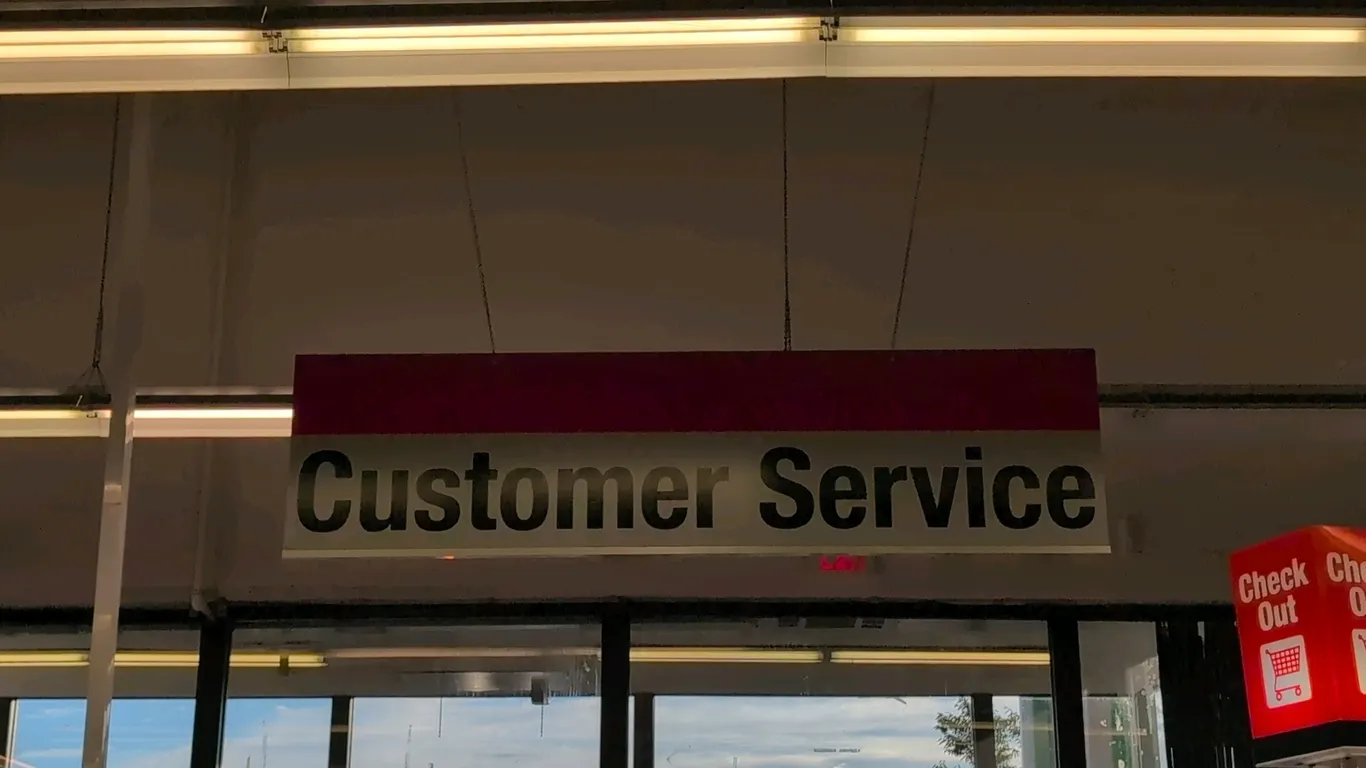 Assorted retail store hanging department and directional signs. Includes signage for Customer Service, Printers, Mobile Accessories, Computers & Table
