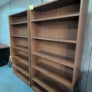 Laminate wood 6-tier bookcases. Features a woodgrain finish with adjustable shelving. Dimensions: 3'L x 1'W x 6'H each.