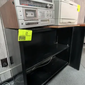 Metal 2-tier cabinet. Features black finish and one adjustable shelf. 35"L x 12"W x 29"H. Electronics and items on top not included.