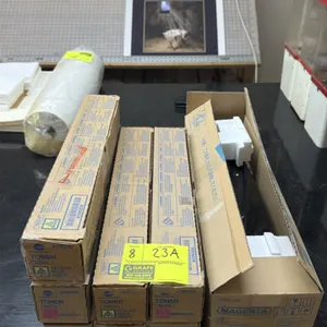 Konica Minolta assorted printer toner cartridges and developer unit. Includes (2) TN-321Y yellow, (2) TN-321C cyan, (3) TN-321M magenta toner cartridg