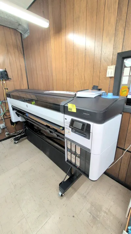 2022 HP DesignJet Z6 Pro 64" large-format production printer. Features roll feed, media catch basket, touchscreen control panel, extra ink cartridges,