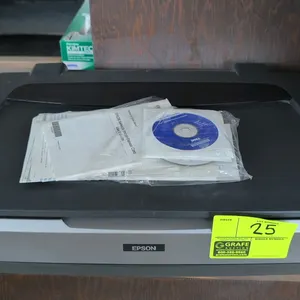 Epson Expression 10000 XL (Model J181A) wide-format graphic arts flatbed scanner. Includes user's guide and software discs. S/N: FVS0016345. Electrica