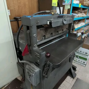 Challenge Style F Size 305 paper cutter. Features hydraulic clamp and blade operation, 30.5" cutting width, cast iron bed with adjustable backgauge, a