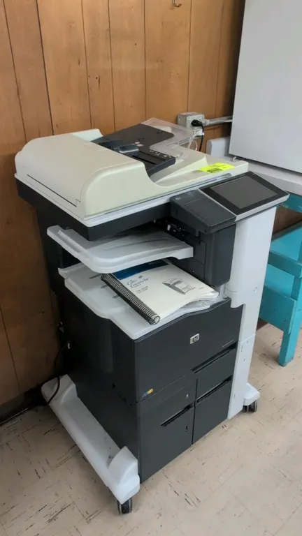 2014 HP LaserJet 700 color MFP M775 multifunction laser printer. Features color touchscreen display, flatbed scanner with automatic document feeder, a