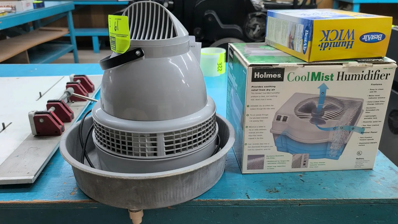 Humidifier lot. Includes (1) Holmes HM-1550 2.2-gallon cool mist humidifier in box, (1) commercial-grade centrifugal dome humidifier with basin, and (