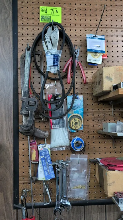 Assorted hand tools and shop hardware. Includes pipe wrench, adjustable wrench, Masterforce 17mm combination wrench, Blackhawk snap ring pliers, locki