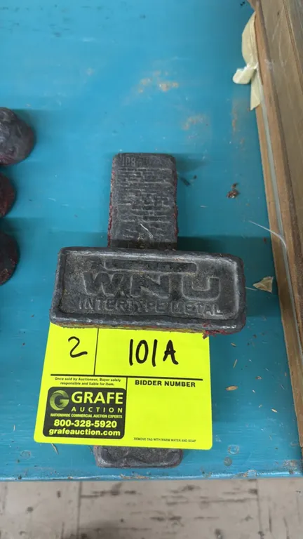 WNU Intertype metal lead weight blocks. Includes 5.5 lb and 2.5 lb blocks.
