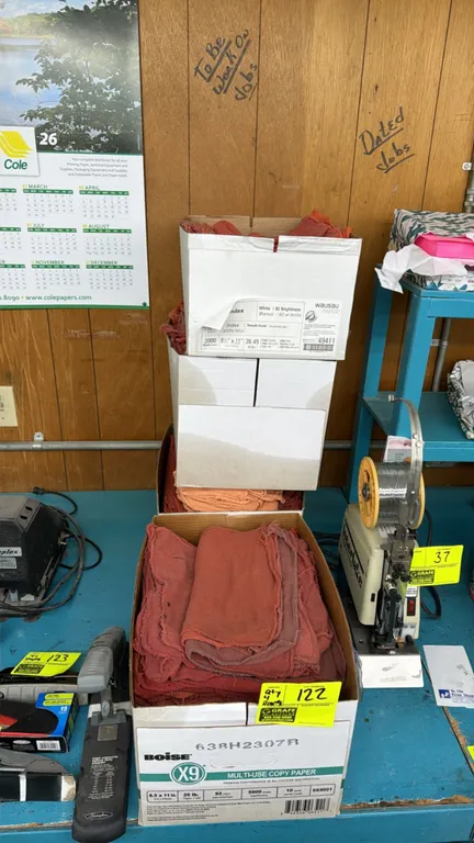 Assorted cloth shop and oil rags. Stored in cardboard boxes. Surrounding equipment not included.