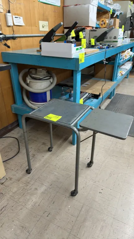 Portable metal side table with folding leaf. Features tubular metal frame construction and a single folding drop leaf. Dimensions: 15" x 17" x 24". Mo
