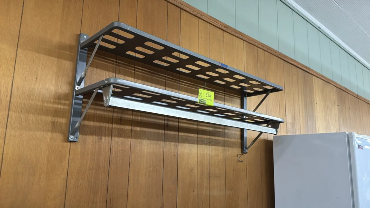 Office wall accessory lot. Includes 4'L 2-tier metal wall-mounted shelf rack with hanger bar, framed cork bulletin board, Sterling & Noble wall clock,