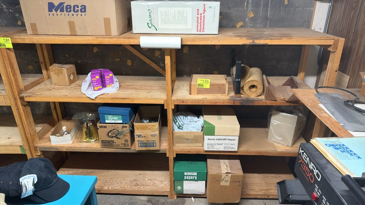 Wood 4-tier storage rack. 8'L x 2'W x 5'H. Features solid wood framing with four tiers of plywood shelving. Contents not included.