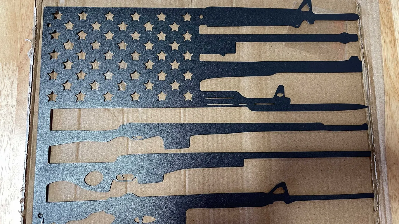 Laser cut metal sign of flag and rifles (T2)