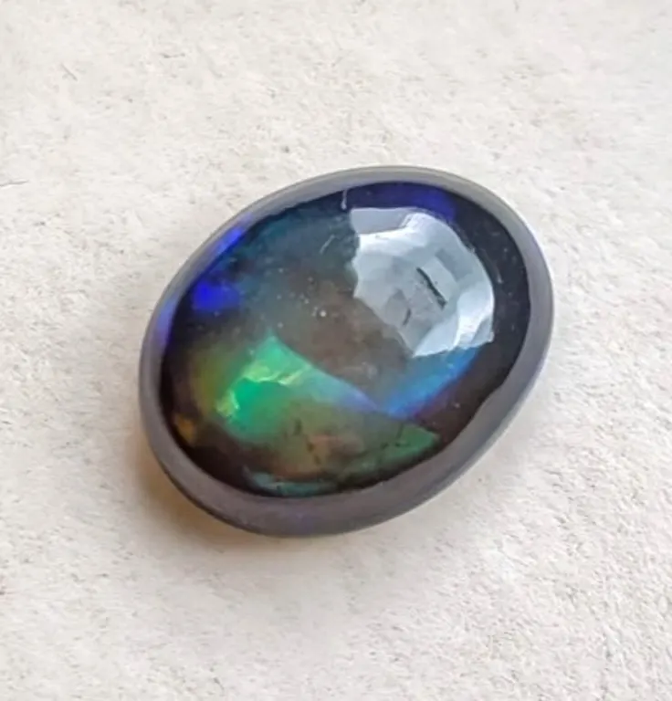 3.85 ct Certified Black Opal gemstone ($2,887 Appraisal)