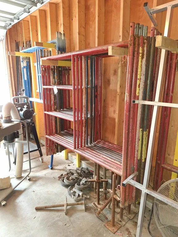 Scaffolding: 14 Wasco 5'x5' Uprights, 4 Bil-Jax 5'x5' Uprights, 8 Wheels, 14 Leveling Feet, Railing, Stairs, Crossbraces