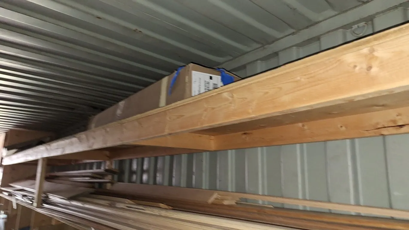 Assorted Lumber on Top 2 Shelves