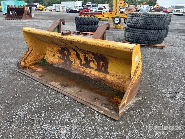 Cat 96 in Backhoe Loader Bucket