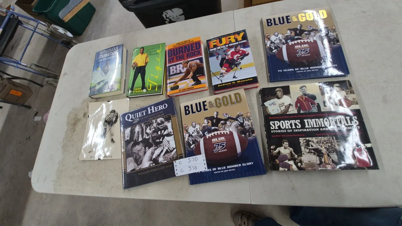 Sports Books and Memorabilia: Blue and Gold, Quiet Hero, Sports Immortals, Tiger Woods