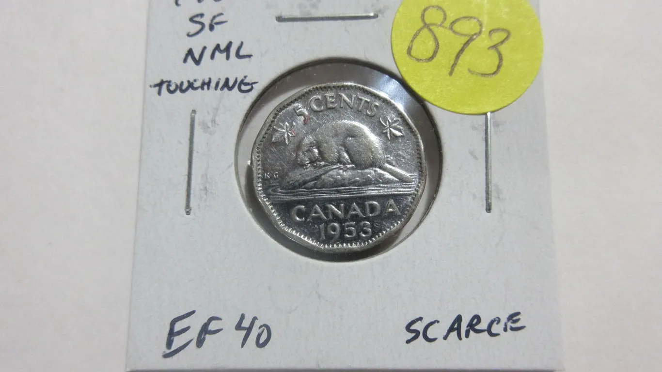 1953 Shoulder Fold Near Maple Leaf with ML touching the Rim. EF. Scarce.