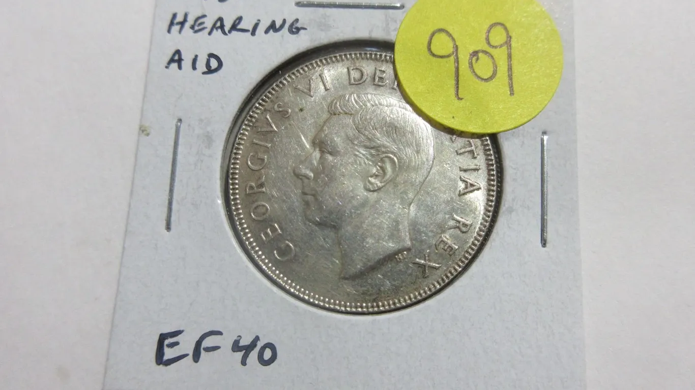 1950 Design Silver 50 Cents with Hearing Aid in the King’s Ear from a Die Clash. EF40. Scar
