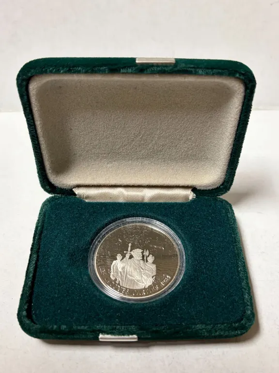 1984 Cartier Nickel Dollar. Proof with Ultra Heavy Cameo. Housed in its original RCM case and box.