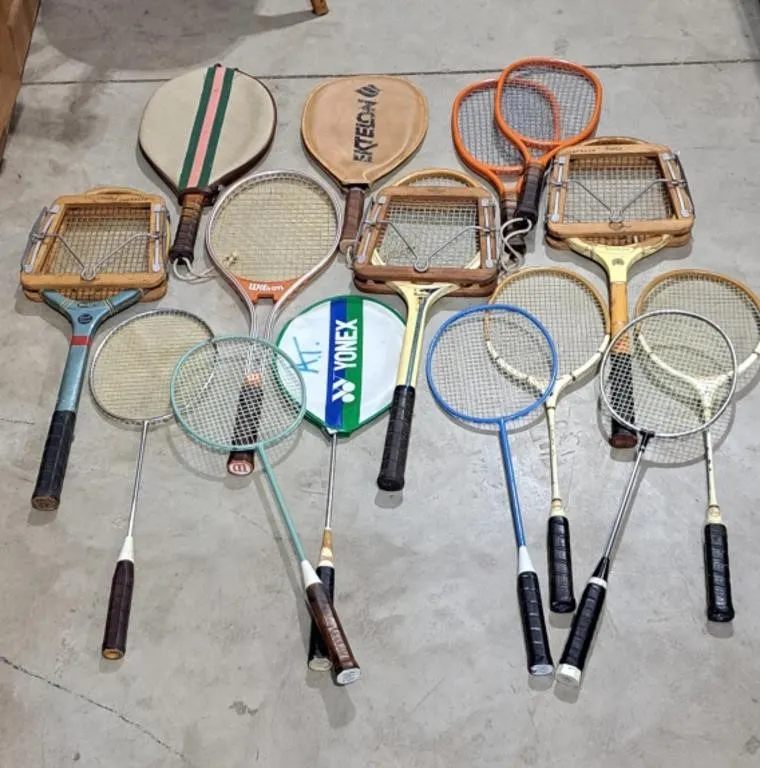 Lot of tennis and badminton rackets