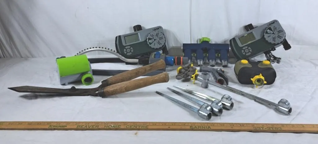 Lot of garden items, sprinklers, trimmers, hose