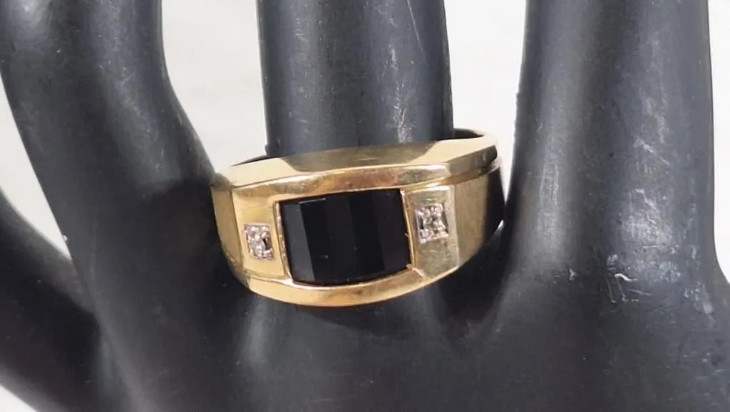Gorgeous 10K ring with black onyx and 2 diamonds.