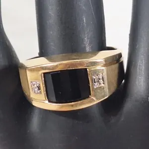 Gorgeous 10K ring with black onyx and 2 diamonds.
