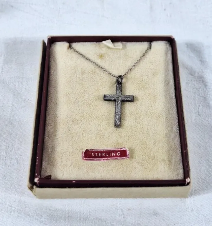 Sterling cross pendant with unmarked chain