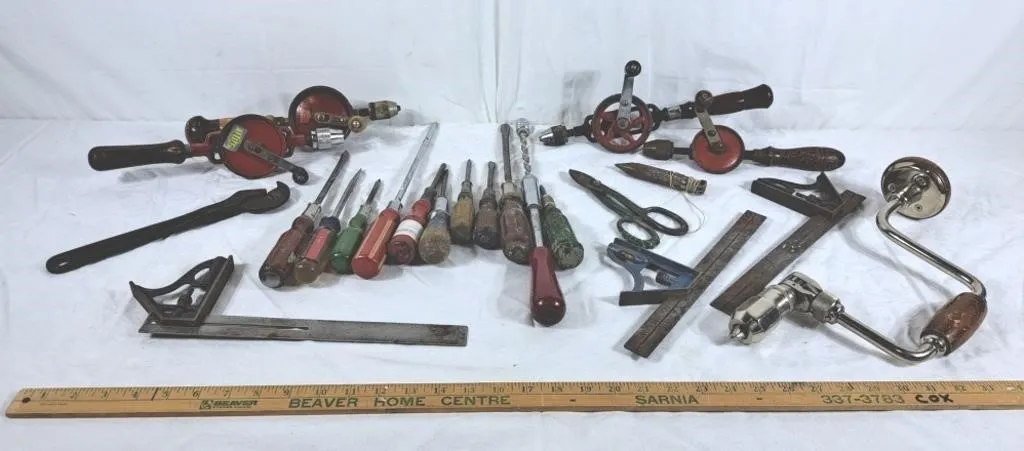 Lot of old wooden handle tools. Screwdrivers,