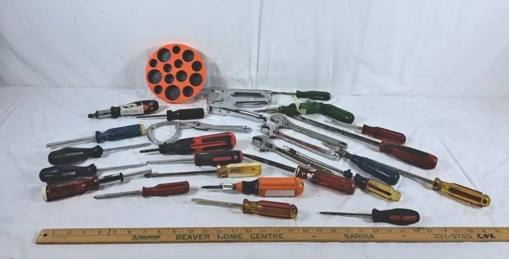 Lot of tools. Screwdrivers, wrenches, stapler and