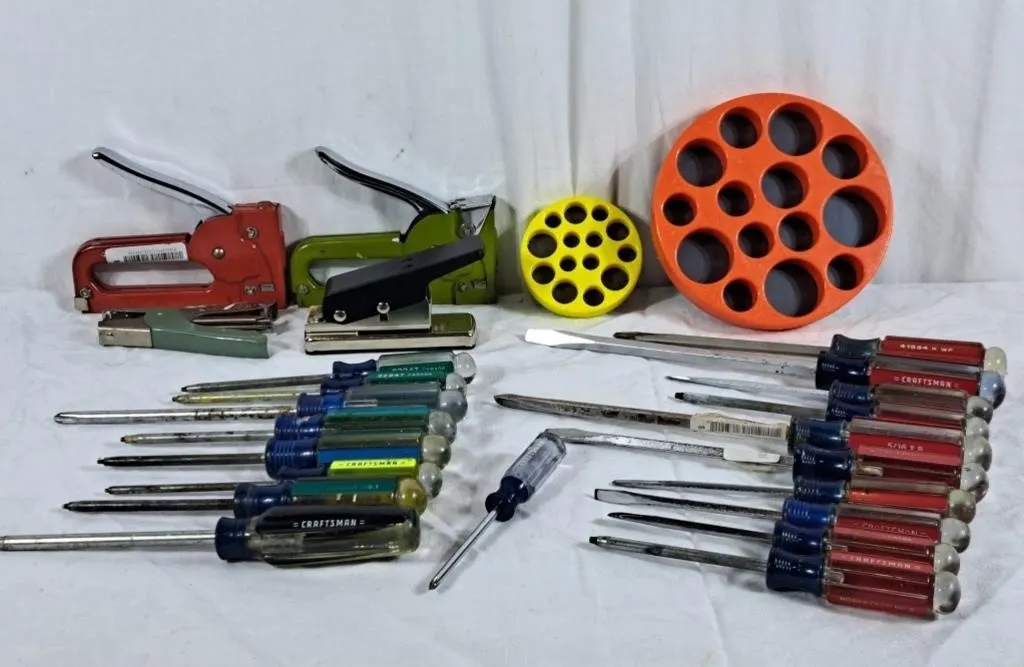 Lot of craftsman screwdrivers, staplers, guitar
