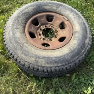 Bridgestone LT265/75R16 Tire c/w 8 Bolt Rim