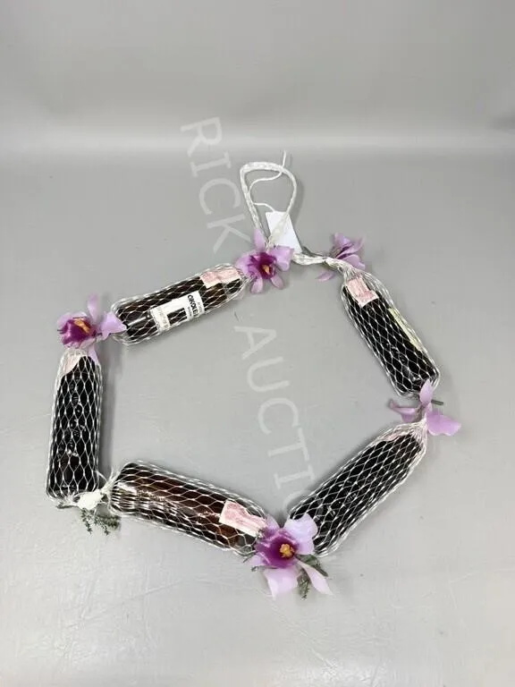 Spirit of Hawaii sample liquor bottles in a Lei