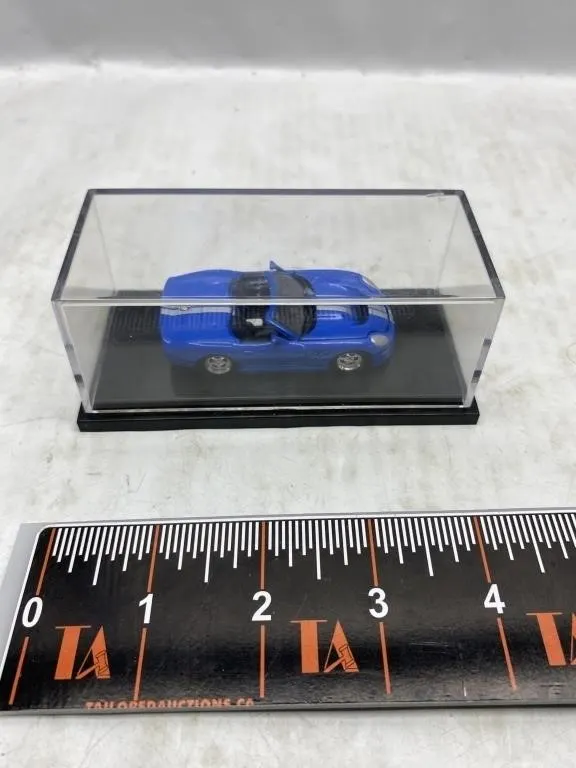 Blue Sports Car Diecast Model in Display Case