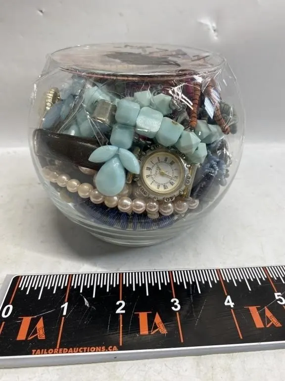 Glass jar of assorted costume jewelry