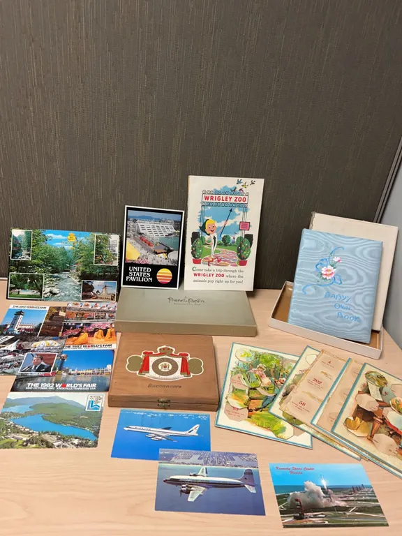 Ephemera Collection Featuring 1982 World’s Fair Postcards, Baby Book, Vintage Games, Cigar Box, and