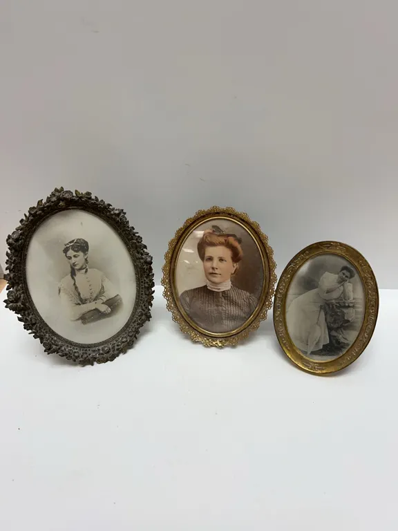 Three Late 19th to Early 20th Century Oval Portraits in Ornate Brass Frames, Varied Styles and Finis