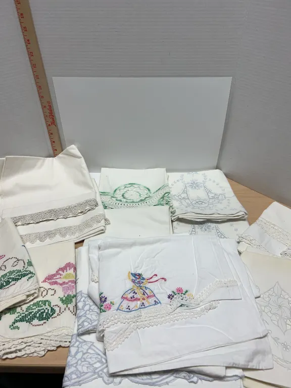 Embroidered and Crocheted Pillowcases with Floral and Decorative Designs