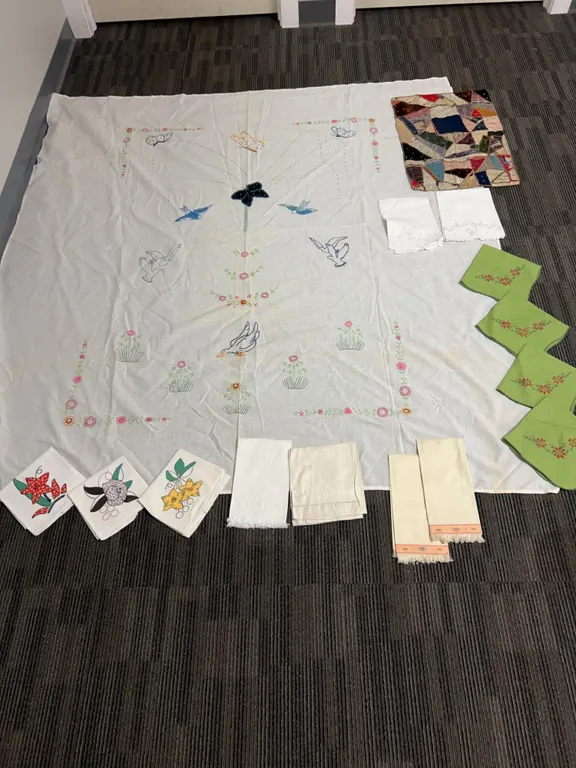 Hand-Embroidered Linens Including Tablecloth, Napkins, Crazy Quilt Piece, and Decorative Textiles