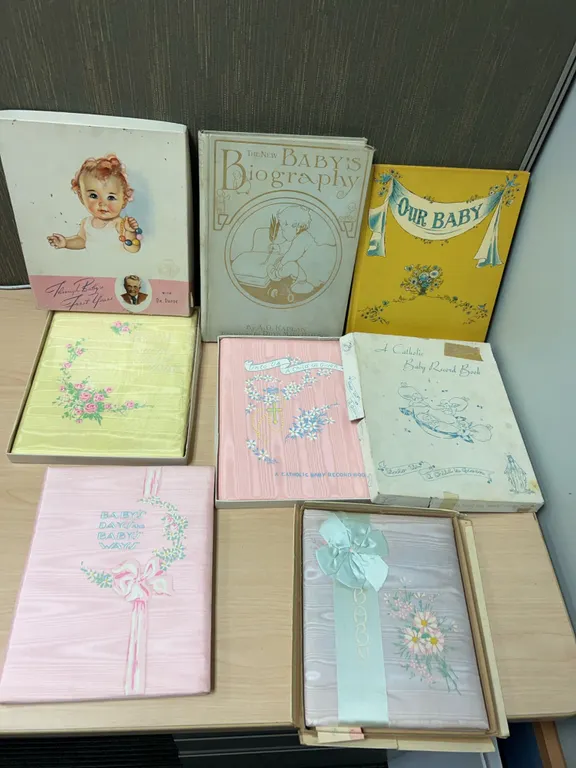 Mid-20th Century Baby Record Books Including Dr. Dafoe and A Catholic Baby Record Book