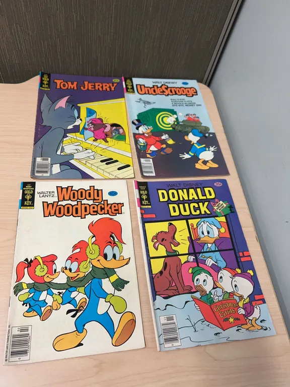 Four Whitman/Gold Key Comic Books: Woody Woodpecker (1979), Donald Duck, Uncle Scrooge, Tom and Jerr
