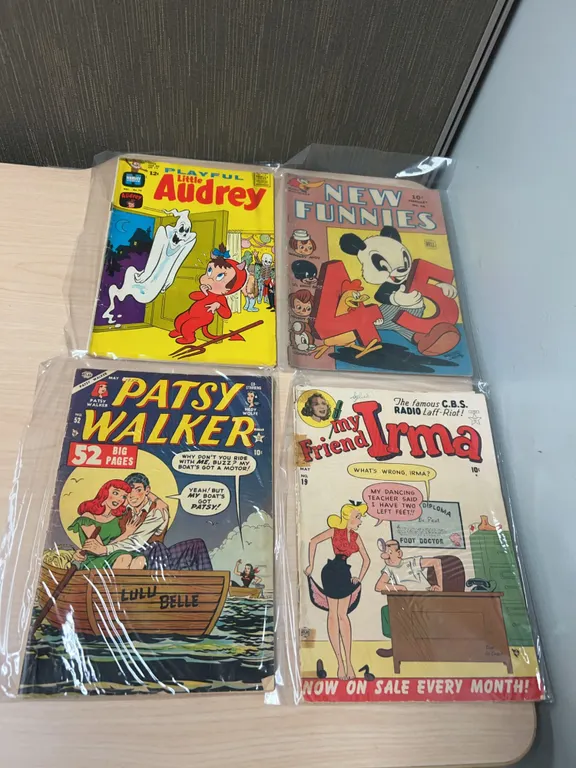 Four Golden and Silver Age Comic Books Including New Funnies, My Friend Irma, Patsy Walker, and Play