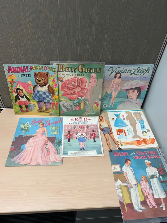 Classic Paper Doll Books Featuring Celebrities, Animals, and Historical Themes (7 Books)