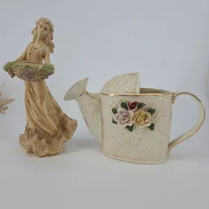 Two Piece Ceramic Flower Pitcher and Small Girl Statue