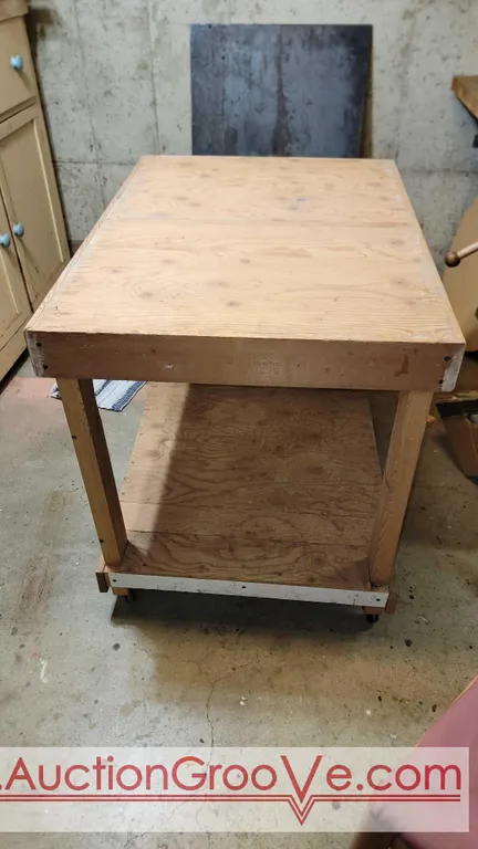 26" x 36" x 30" tall cart/table with wheels. 2 x 4s & plywood. Located in basement bring capable helped to move. BN